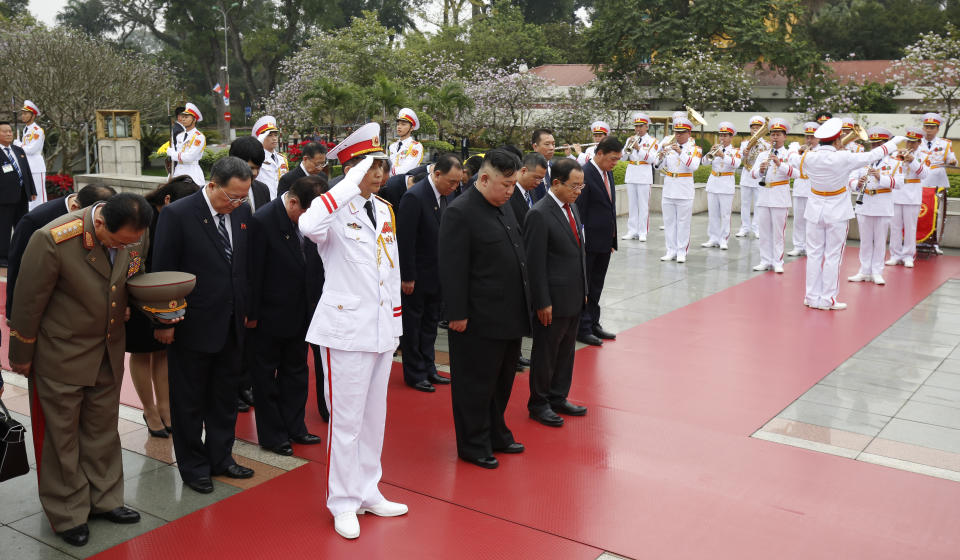 North Korean leader Kim Jong Un, center, attends a wreath laying ceremony at Monument to War Heroes and Martyrs in Hanoi, Vietnam Saturday, March 2, 2019. (Kham/Pool Photo via AP)