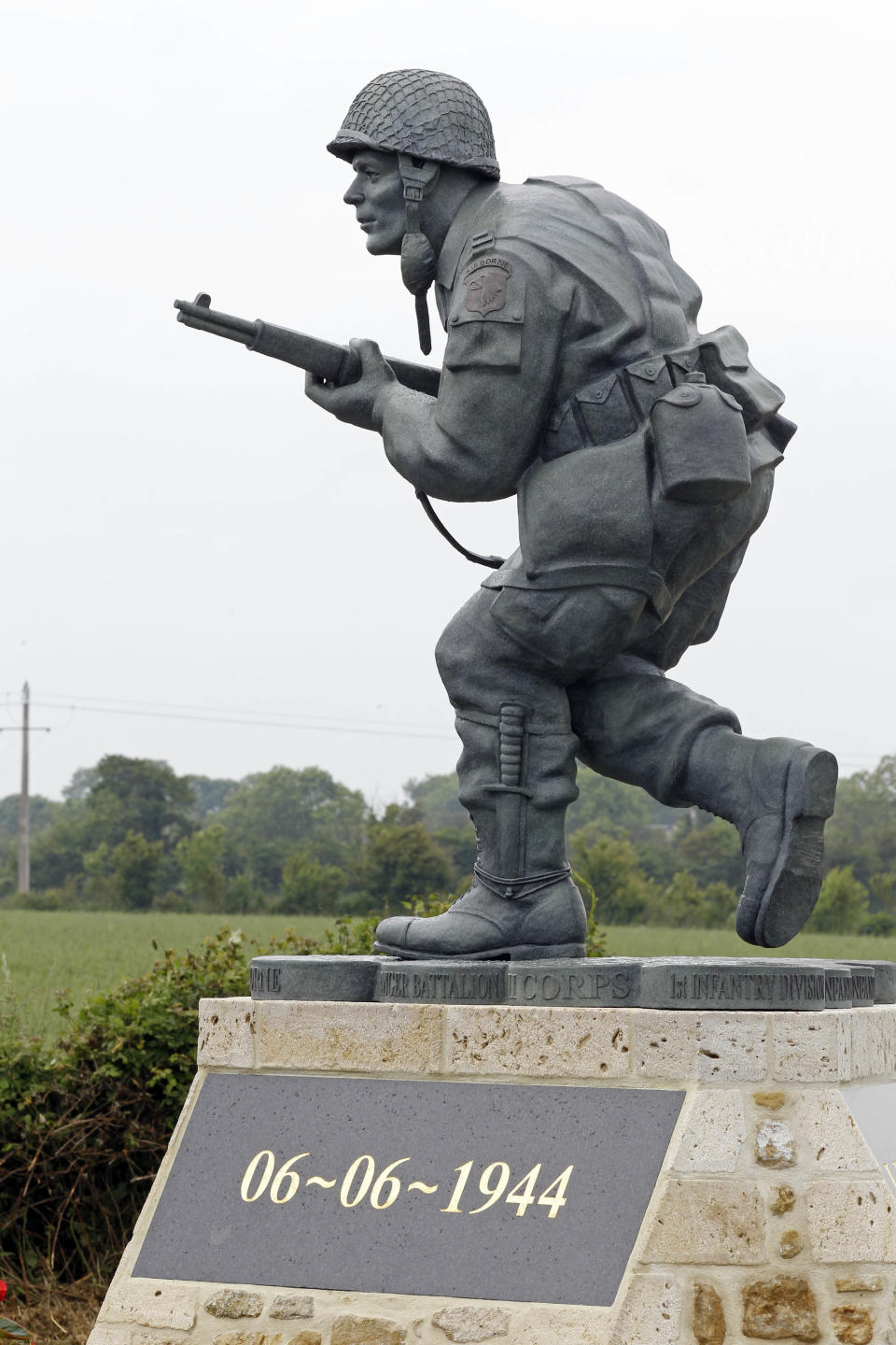 In this picture taken on Tuesday, June 5, 2012, shows the Colorado-made statue of Pennsylvania native Maj. Dick Winters, unveiled on Wednesday, June 6, 2012 near the beaches where the D-Day invasion of France began in 1944, one of many events marking the 68th anniversary of D-Day, the Allied operation that paved the way for the end of the war. The bronze statue built near the village of Sainte Marie du Mont, is a tribute to a man whose quiet leadership was chronicled in the book and television series "Band of Brothers." (AP Photo/Remy de la Mauviniere)