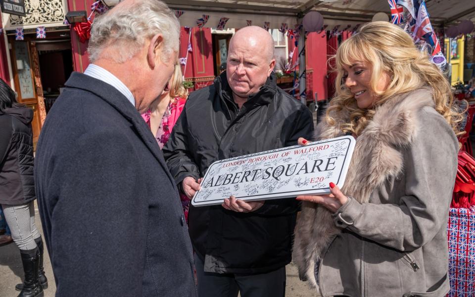 The Prince of Wales was presented with an Albert Square street sign from Steve McFadden and Letitia Dean - Aaron Chown/PA