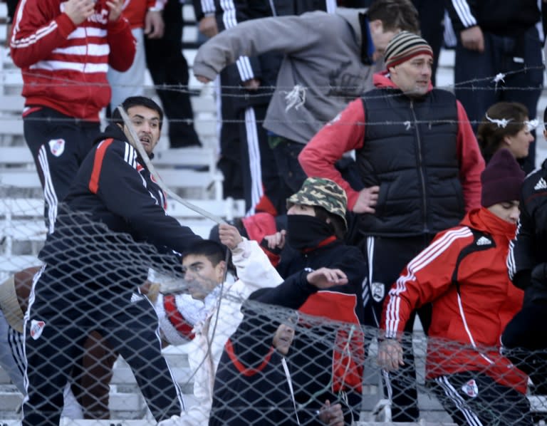 Supporters of River Plate react with violence after the team was relegated to second division after a match at Monumental stadium in Buenos Aires, in 2011