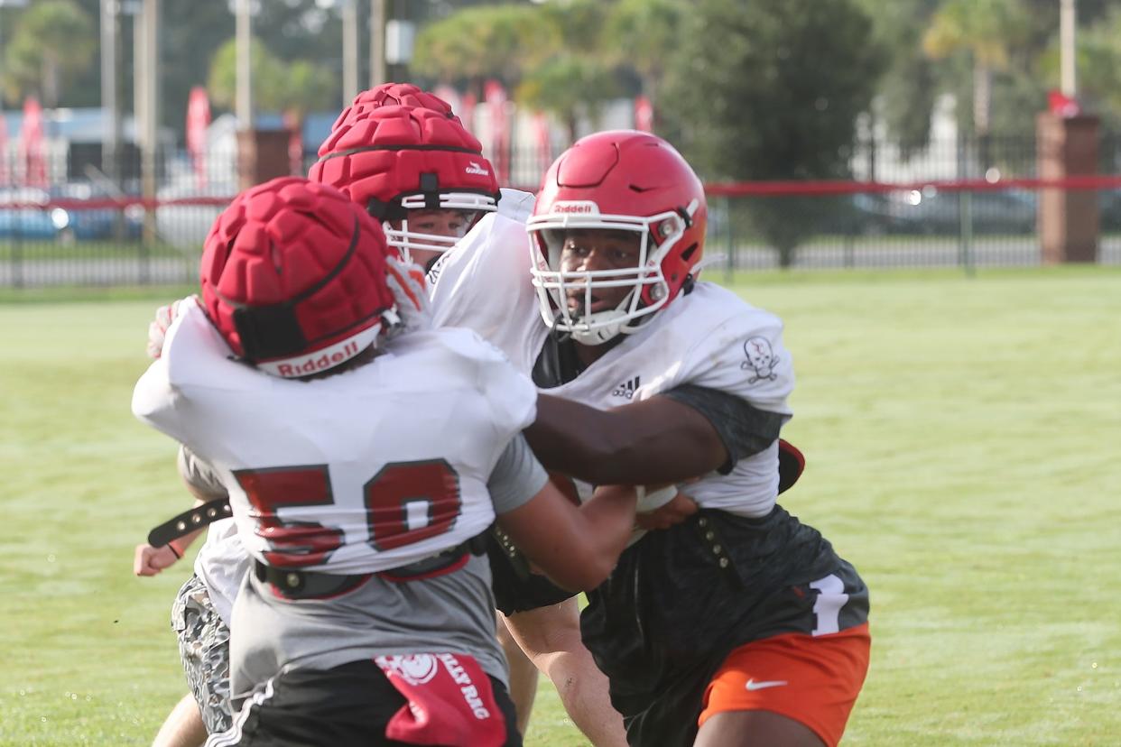 Defensive lineman Elijah Griffin works against a double team during practice.