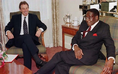 Tony Blair and Robert Mugabe in 1997 - Credit: PA Wire