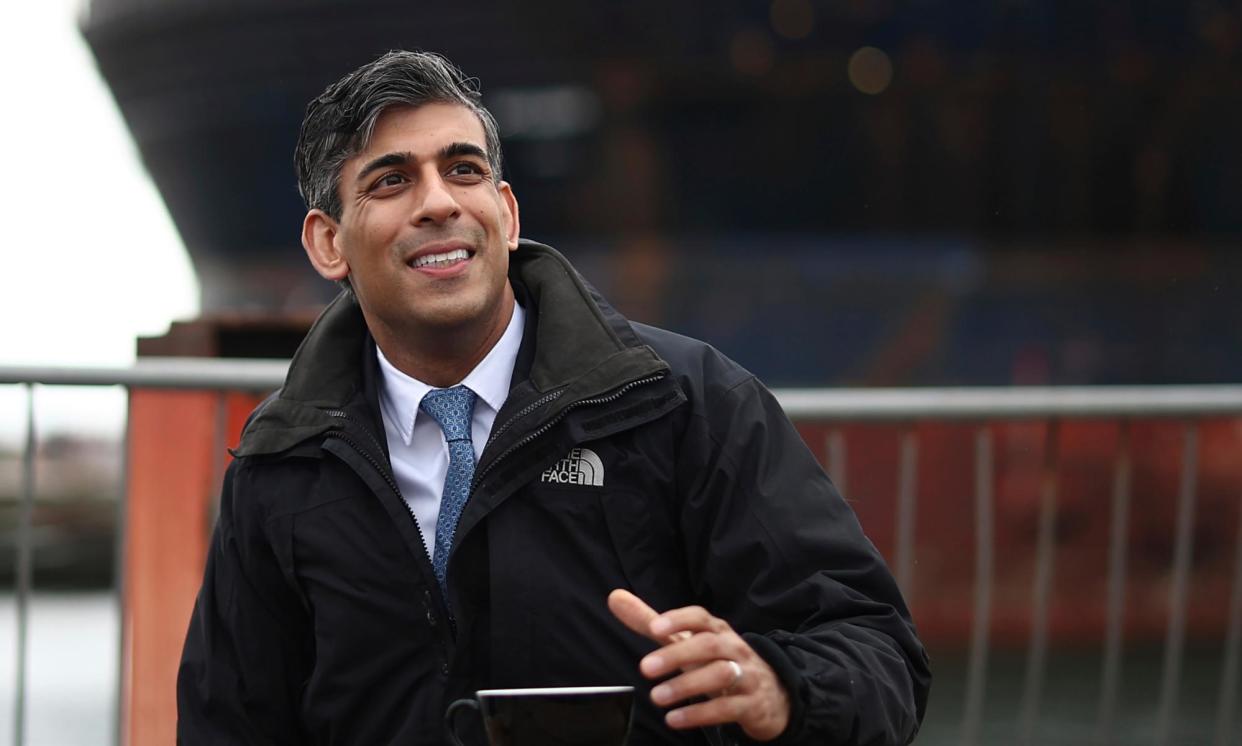 <span>Rishi Sunak on a visit to the Port of Nigg in north-east Scotland on Thursday.</span><span>Photograph: Henry Nicholls/AP</span>