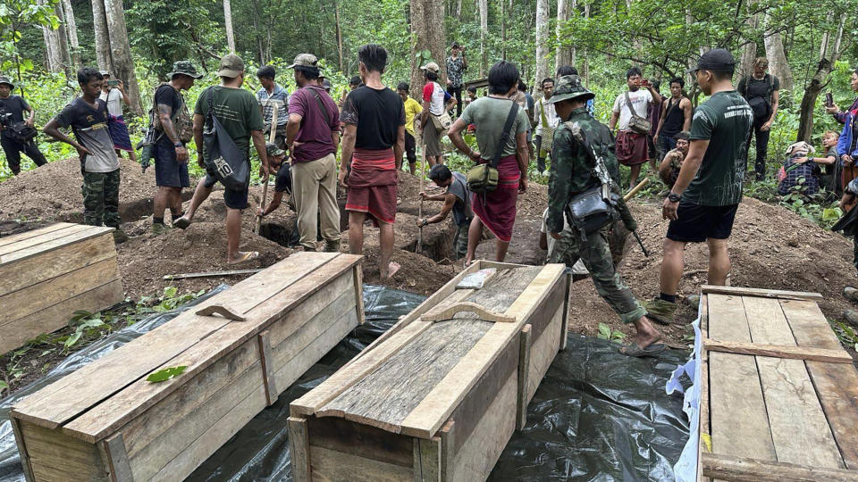 Villagers and resistance fighters bury what they say are victims of an airstrike by planes of the military government, outside the town of Pasuang in Myanmar's eastern state of Kayah on Sunday, June 25, 2023. The military government use air and ground attacks to try to crush the armed resistance that arose after the military seized power from the elected government of Aung San Suu Kyi in February 2021. Fighting has been fierce in southern Kayah, where members of an army-established ethnic Karenni militia recently defected en masse to the resistance side.(Free Burma Rangers via AP)