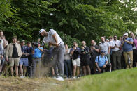 Dustin Johnson of the United States plays from the rough during the first round of the inaugural LIV Golf Invitational at the Centurion Club in St. Albans, England, Thursday, June 9, 2022. (AP Photo/Alastair Grant)