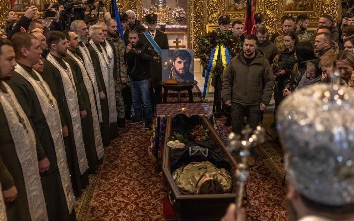 Volodymyr Zelensky mourns the death of killed Ukrainian soldier Dmytro Kotsyubaylo during a funeral service - Roman Pilipey/Getty Images Europe