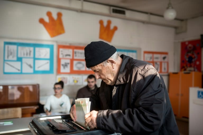 A man casts his ballot at a polling station in Skopje on December 11, 2016