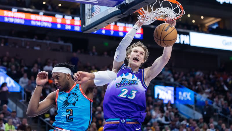 Utah Jazz forward Lauri Markkanen (23) dunks the ball over Phoenix Suns forward Josh Okogie (2) during an NBA game against the Phoenix Suns at Vivint Arena in Salt Lake City on March 27, 2023. The Jazz will host the Suns at the Delta Center on Sunday, Nov. 19, 2023, the first of three Jazz home games on a Sunday in the upcoming season.