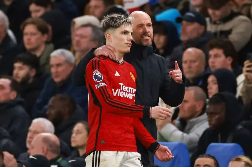 Alejandro Garnacho receives instructions from Manchester United manager Erik ten Hag.