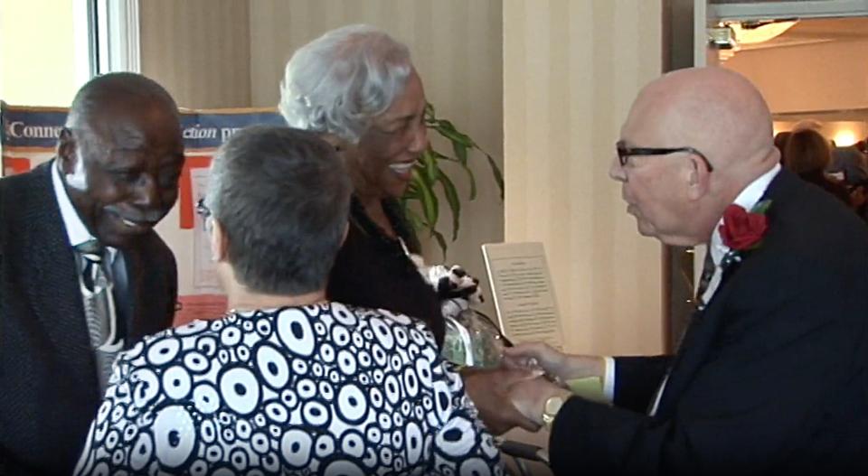 Voni Grimes, left, and Allan M. Dameshek, right during a 2008 event honoring Dameshek