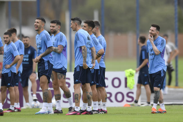 Argentina's Lionel Messsi, right, and Angel Di Maria, center, attend a team training session at the Argentina Soccer Association in Buenos Aires, Argentina, Tuesday, March 21, 2023.(AP Photo/Gustavo Garello)