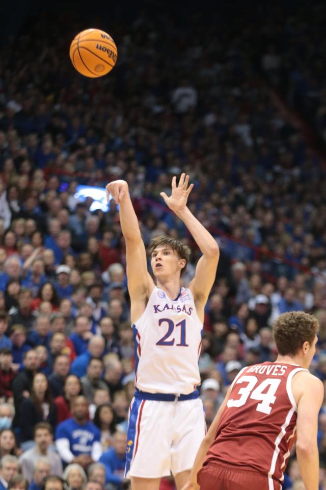 Zach Clemence (21) sinks a three-pointer for Kansas during the first half of a game in January against Oklahoma inside Allen Fieldhouse.