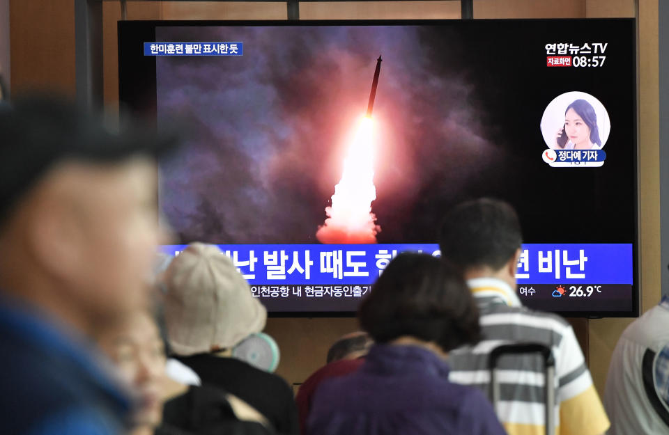 People watch a television news screen showing file footage of North Korea's missile launch, at a railway station in Seoul on August 10, 2019. - North Korea fired two "unidentified projectiles" on August 10, into the sea, South Korea's Yonhap news agency reported, citing the country's Joint Chiefs of Staff -- the latest in a series of such launches by Pyongyang. (Photo by Jung Yeon-je / AFP)        (Photo credit should read JUNG YEON-JE/AFP/Getty Images)