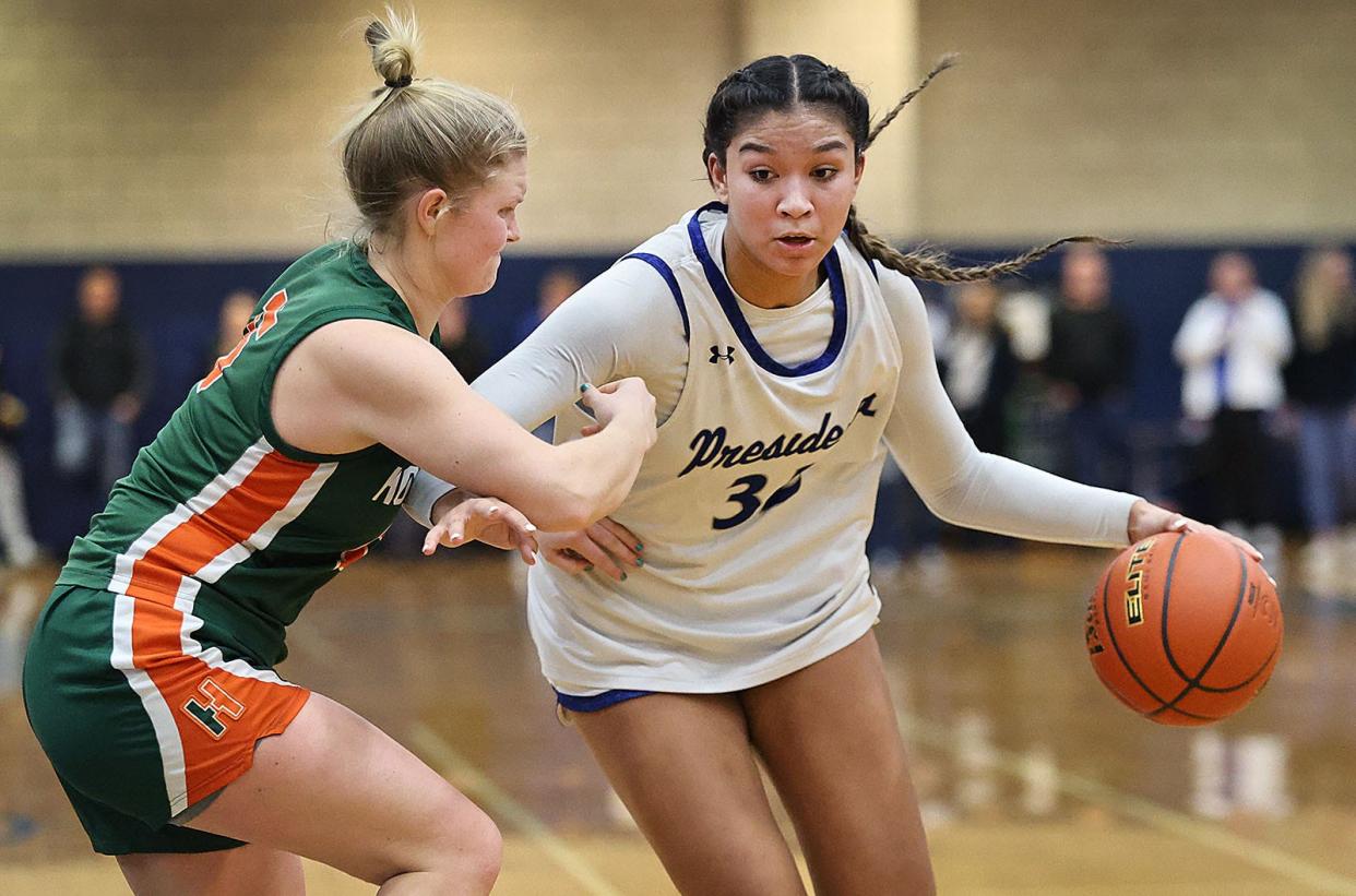 Hopkinton #15 Holly Paharik tries to stop Presidents Alyssa Hopps from get to the hoop.

The Quincy High Presidents hosted the Hopkinton Hillers in girls MIAA basketball playoffs on Friday, March. 1, 2024