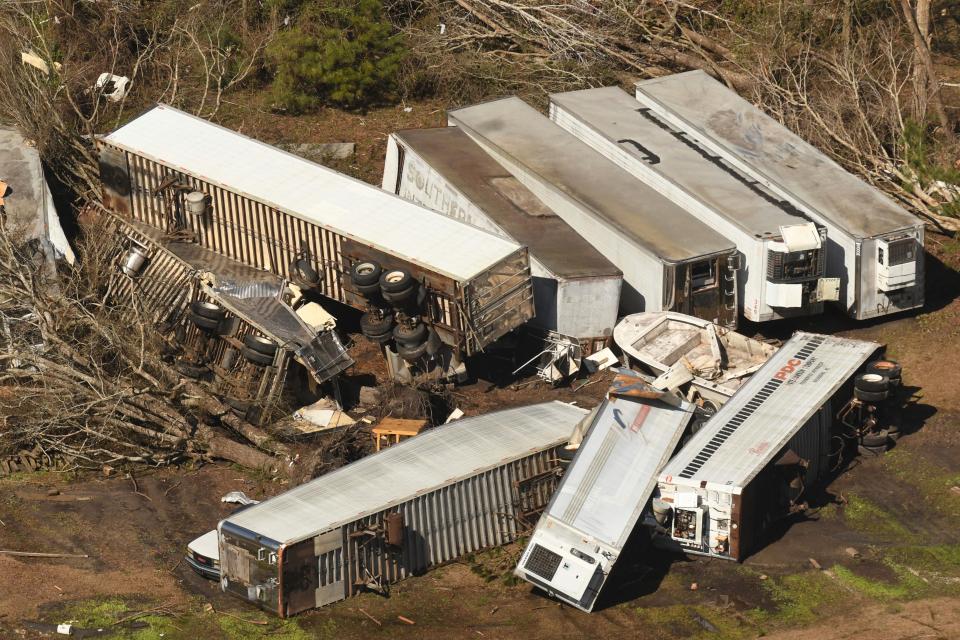 Tractor-trailers were blown away with the force of windsAP