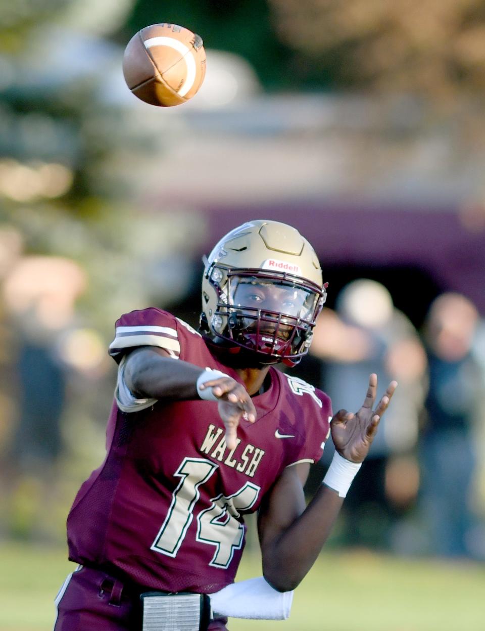 Walsh quarterback Amare Jenkins throws a pass during the first quarter of Thursday's season opener against West Liberty.