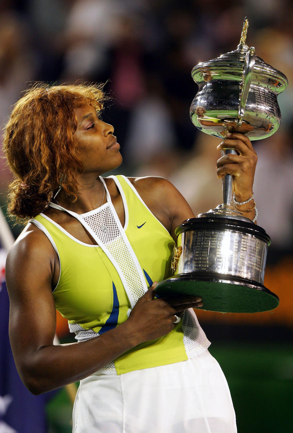 Serena Williams of the USA stares at the trophy after defeating Lindsay Davenport of the USA during the Women's Final during day thirteen of the Australian Open Grand Slam at Melbourne Park January 29, 2005 in Melbourne, Australia. (Photo by Chris McGrath/Getty Images)