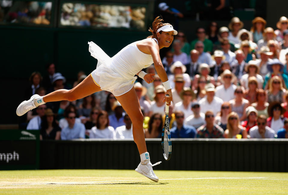 LONDON, ENGLAND - JULY 11:  Garbine Muguruza of Spain serves in the Final Of The Ladies' Singles against Serena Williams of the United States during day twelve of the Wimbledon Lawn Tennis Championships at the All England Lawn Tennis and Croquet Club on July 11, 2015 in London, England.  (Photo by Julian Finney/Getty Images)