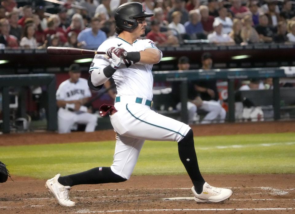 Arizona Diamondbacks' Josh Rojas (10) hits an RBI single against the Atlanta Braves  on June 4, 2023, at Chase Field in Phoenix.