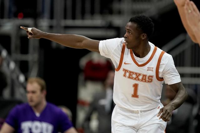 Texas players hold up jersey of Andrew Jones, who is battling leukemia,  after beating No. 16 TCU in 2OT – New York Daily News