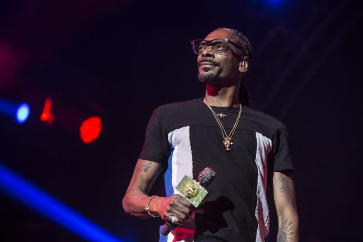 Snoop Dogg is ready to test his talents on the mic from the broadcast booth. (Getty)