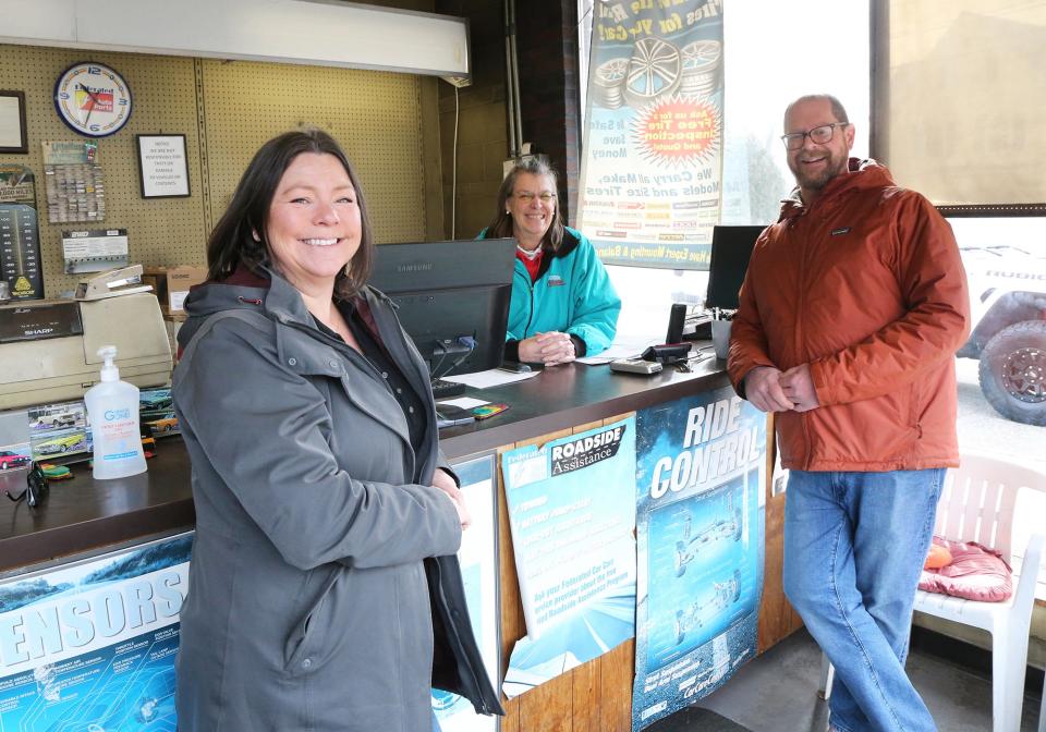 Maine Meat owners Shannon Hill, left, and Jarrod Spangler, right, have a purchase and sale agreement with Best Automotive owner Cissy Furbish, seen behind the desk at her business Monday, March 11, 2024. Hill and Spangler plan to relocate the butchery and expand to open a restaurant at the new location.