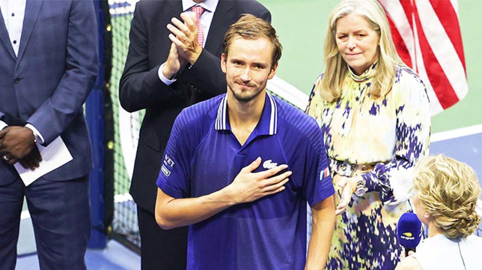 Daniil Medvedev (pictured) gestures on the podium after winning the US Open final.