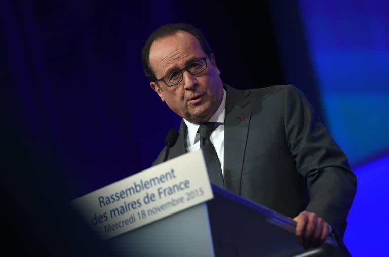 French President Francois Hollande delivers a speech during a meeting of French mayors in Paris on November 18, 2015