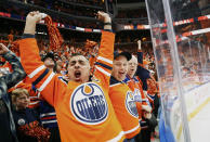 Edmonton Oilers fans cheer a goal during the third period of Game 5 of an NHL hockey Stanley Cup first-round playoff series against the Los Angeles Kings, Tuesday, May 10, 2022 in Edmonton, Alberta. (Jeff McIntosh/The Canadian Press via AP)