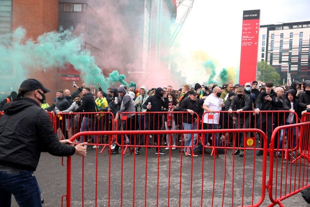 Fans move barriers outside the ground