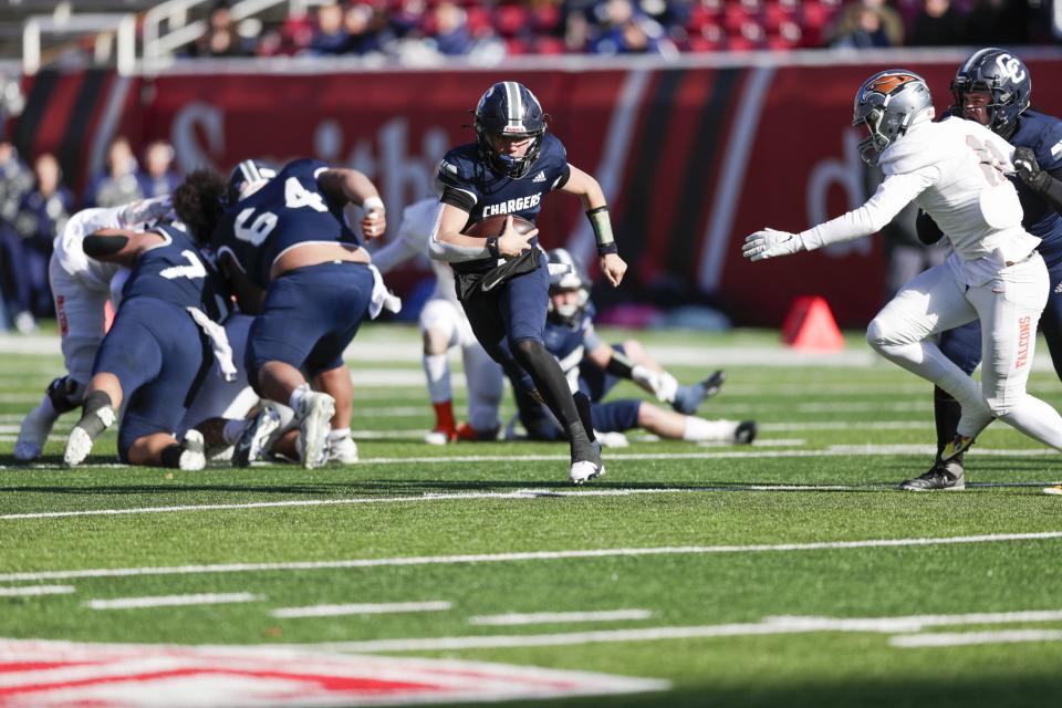 Corner Canyon Chargers QB Isaac Wilson (1) runs the ball while playing the Skyridge Falcons in the 6A state football championship at Rice-Eccles Stadium at the University of Utah in Salt Lake City on Friday, Nov. 18, 2022. The Falcons won 17-7. | Ben B. Braun, Deseret News