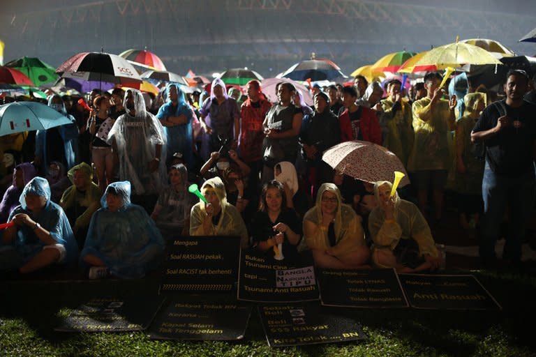 Supporters of the opposition party gather at a stadium in Kelana Jaya, Selangor on May 8, 2013. The rally was called by opposition leader Anwar Ibrahim, who has vowed a "fierce" campaign for electoral reform after losing Sunday's vote and has said he would soon produce evidence of fraud by what he calls an "illegitimate" government