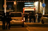 French police officers and forensics teams search for evidence at the site where Strasbourg Christmas market gunman Cherif Chekatt was shot dead by police