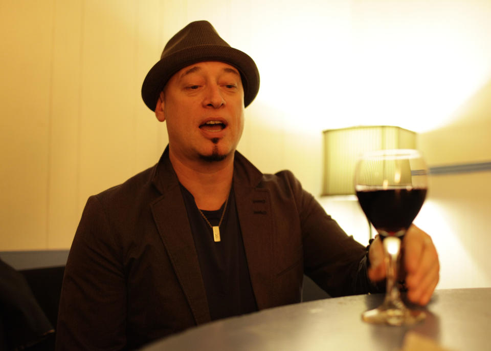 In this photo taken Wednesday April 11, 2012, Jimm Stafford of the band Train samples some of their wine before their concert at the Great American Music Hall in San Francisco. (AP Photo/Eric Risberg)