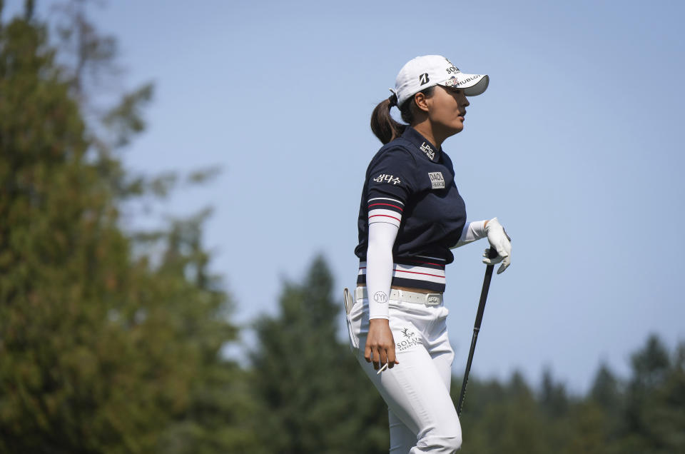 Jin Young Ko, of South Korea, walks from the tee box after hitting her tee shot on the first hole during the first round at the CPKC Canadian Women's Open golf tournament in Vancouver, British Columbia, Thursday, Aug. 24, 2023. (Darryl Dyck/The Canadian Press via AP)