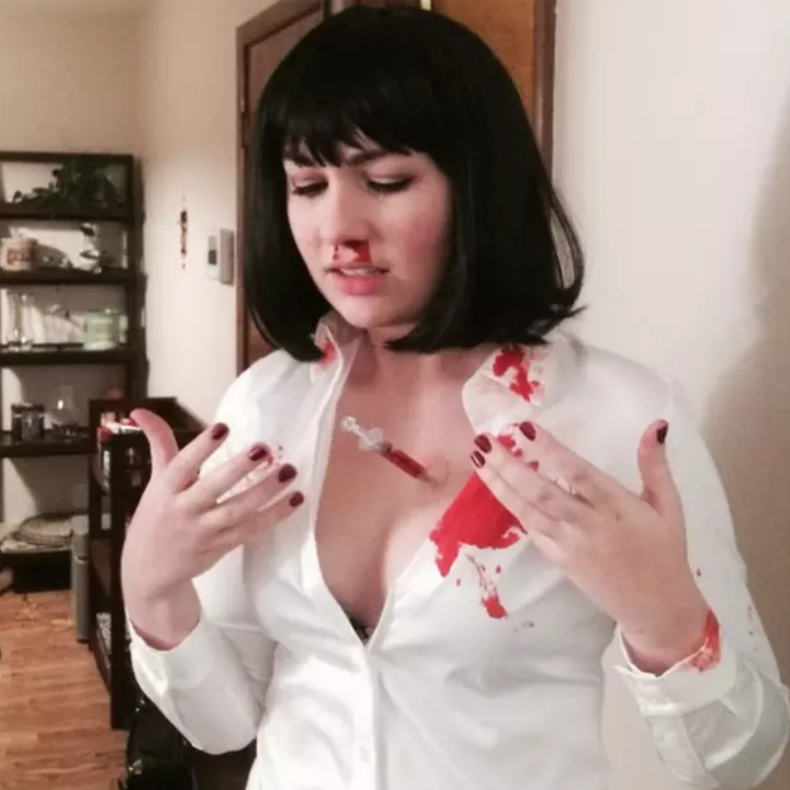 girl in a white shirt with blood on it