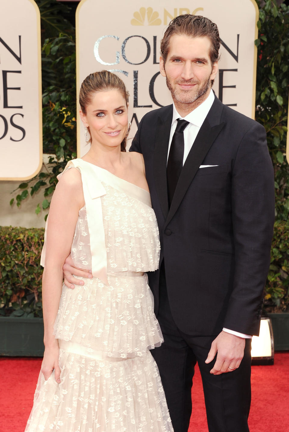 BEVERLY HILLS, CA - JANUARY 15: Actress Amanda Peet and David Benioff arrive at the 69th Annual Golden Globe Awards held at the Beverly Hilton Hotel on January 15, 2012 in Beverly Hills, California. (Photo by Jason Merritt/Getty Images)