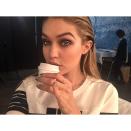 <p>Gigi Hadid looked steaming hot (much like her coffee) on set with a tiny espresso cup. </p>