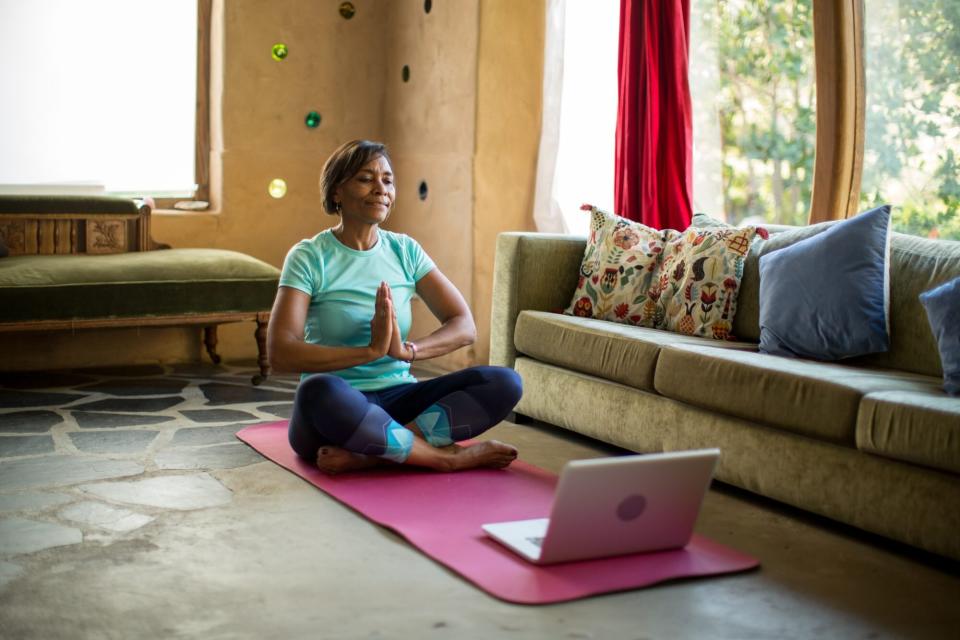 woman practicing yoga indoors