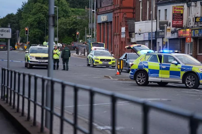 Police taped off the road following the crash