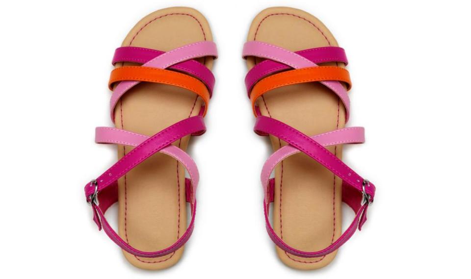 Pink and orange sandals against a white background