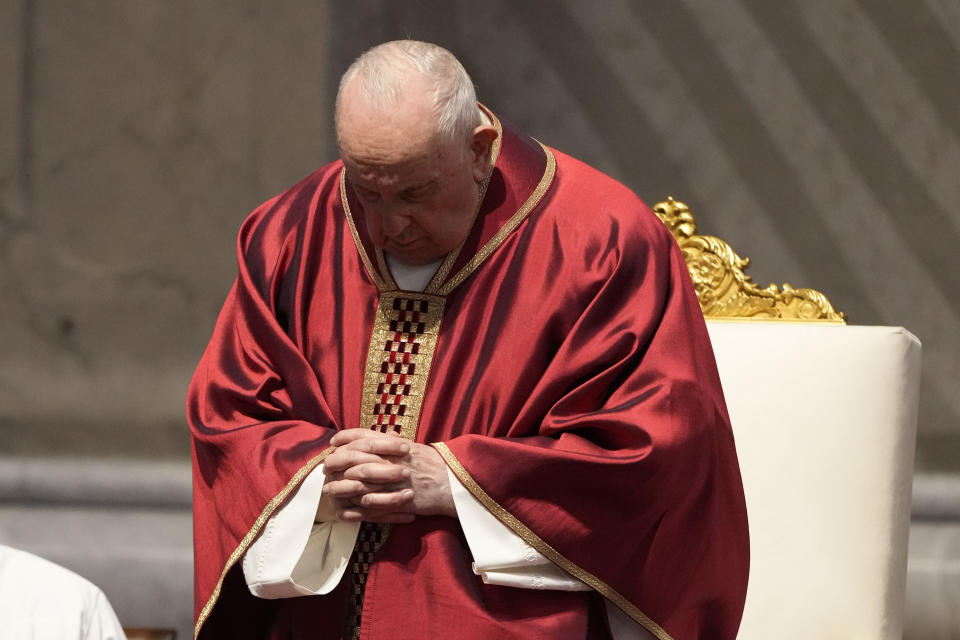 Pope Francis celebrates the Passion Mass on Good Friday, inside St. Peter's Basilica, at the Vatican, Friday, April 7, 2023. (AP Photo/Andrew Medichini)