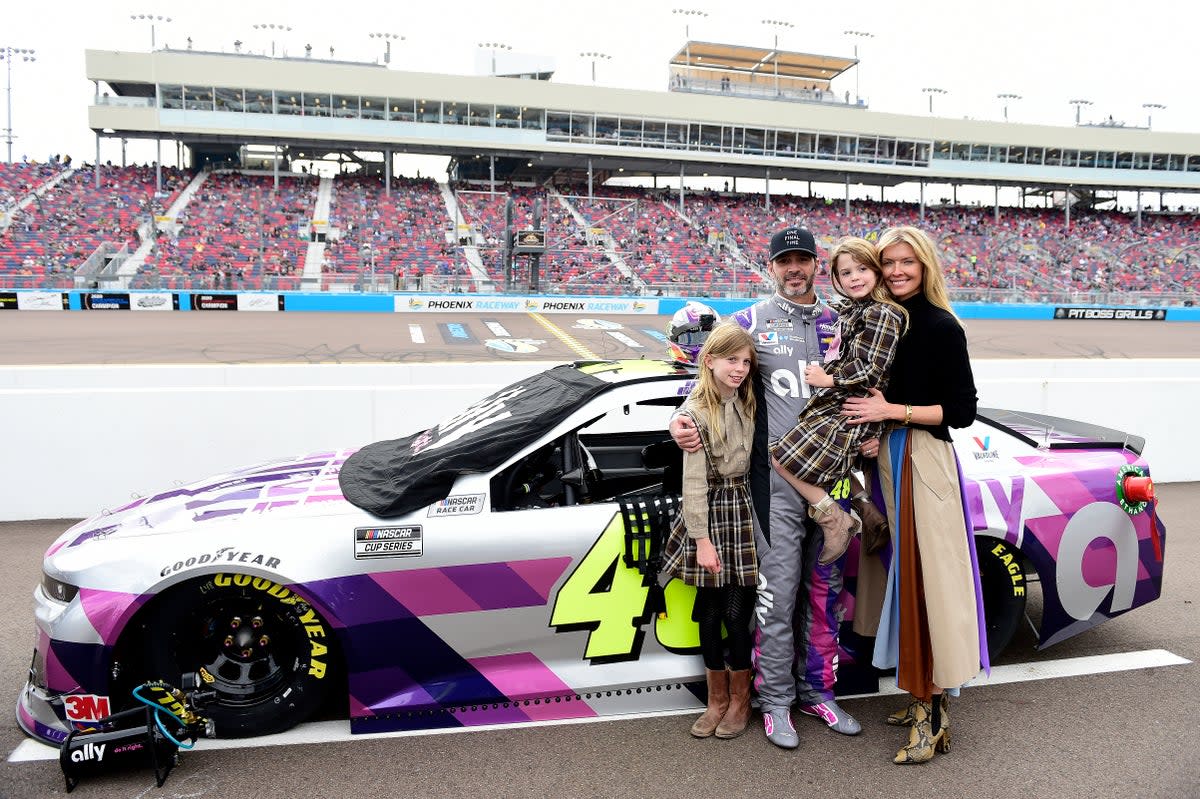 Jimmie Johnson, driver of the #48 Ally Chevrolet, poses on the grid with his wife Chandra Johnson and their daughters Lydia Norriss Johnson and Genevieve Johnson prior to the NASCAR Cup Series Season Finale 500 at Phoenix Raceway on November 08, 2020 in Avondale, Arizona. (Getty Images)