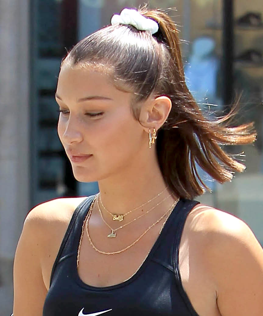 <p>Leave it to Bella Hadid to take a relic from your middle school gym bag and make it look chic. Since no other hair tie is quite as gentle on your hair, she wouldn't have to convince us <em>too much </em>to break one out again. </p>