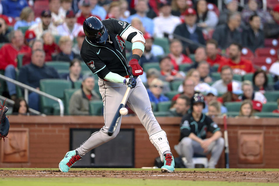 Arizona Diamondbacks' Lourdes Gurriel Jr. hits an RBI single against the St. Louis Cardinals during the third inning of a baseball game Tuesday, April 23, 2024, in St. Louis. (AP Photo/Scott Kane)