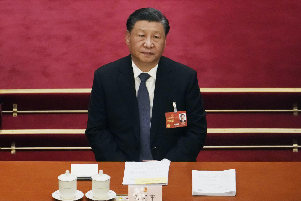 FILE - Chinese President Xi Jinping attends a session of China's National People's Congress (NPC) at the Great Hall of the People in Beijing, Tuesday, March 7, 2023. Xi accused Washington on Monday of trying to isolate his country and hold back its development. That reflects the ruling Communist Party's growing frustration that its pursuit of prosperity and global influence is threatened by U.S. restrictions on access to technology, its support for Taiwan and other moves seen by Beijing as hostile. (AP Photo/Ng Han Guan, File)