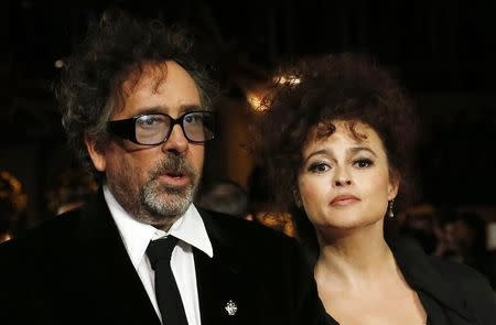 Film director Tim Burton and his wife actress Helena Bonham Carter arrive for the European premiere of his film "Frankenweenie 3D" at the Odeon Leicester Square in central London October 10, 2012. REUTERS/Suzanne Plunkett