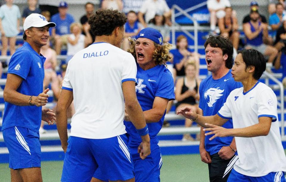 Liam Draxl, middle, celebrates with Gabriel Diallo after Diallo won his match against Wake Forest last Saturday. After the team tournament, Draxl and Diallo will represent Kentucky in NCAA singles play.