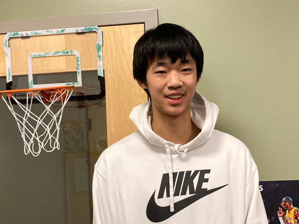 Ziyi Xiong, a freshman basketball player at George School, smiles during an interview at the school.