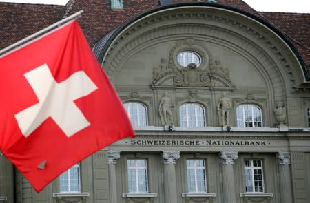 FILE PHOTO: A Swiss flag is pictured in front of the Swiss National Bank (SNB) in Bern